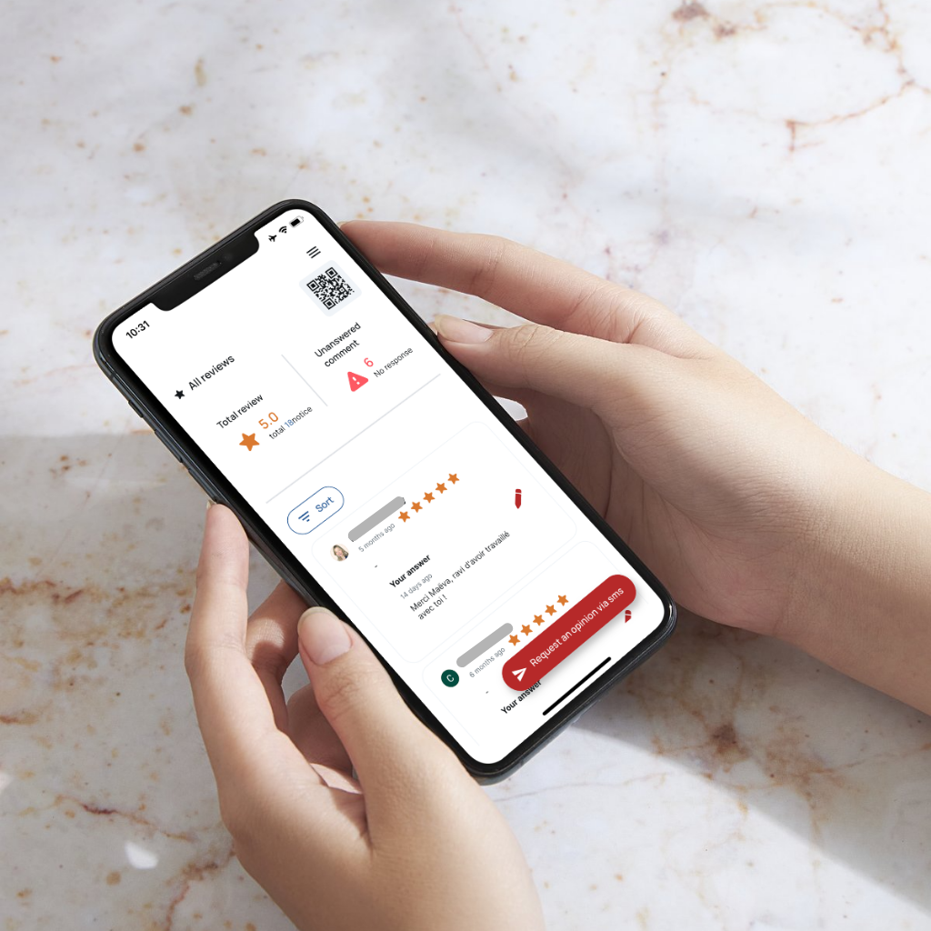 Hand holding phone with mobile app